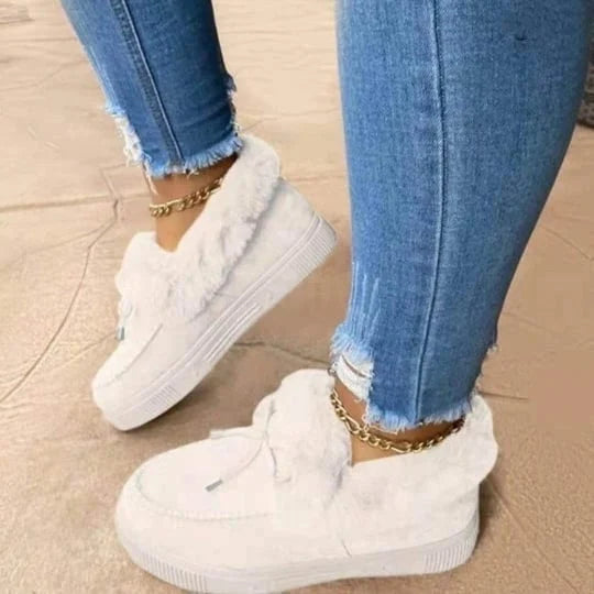 Women's warm winter slip-on shoes featuring a cozy round-toe design. Perfect casual cotton footwear for everyday comfort.