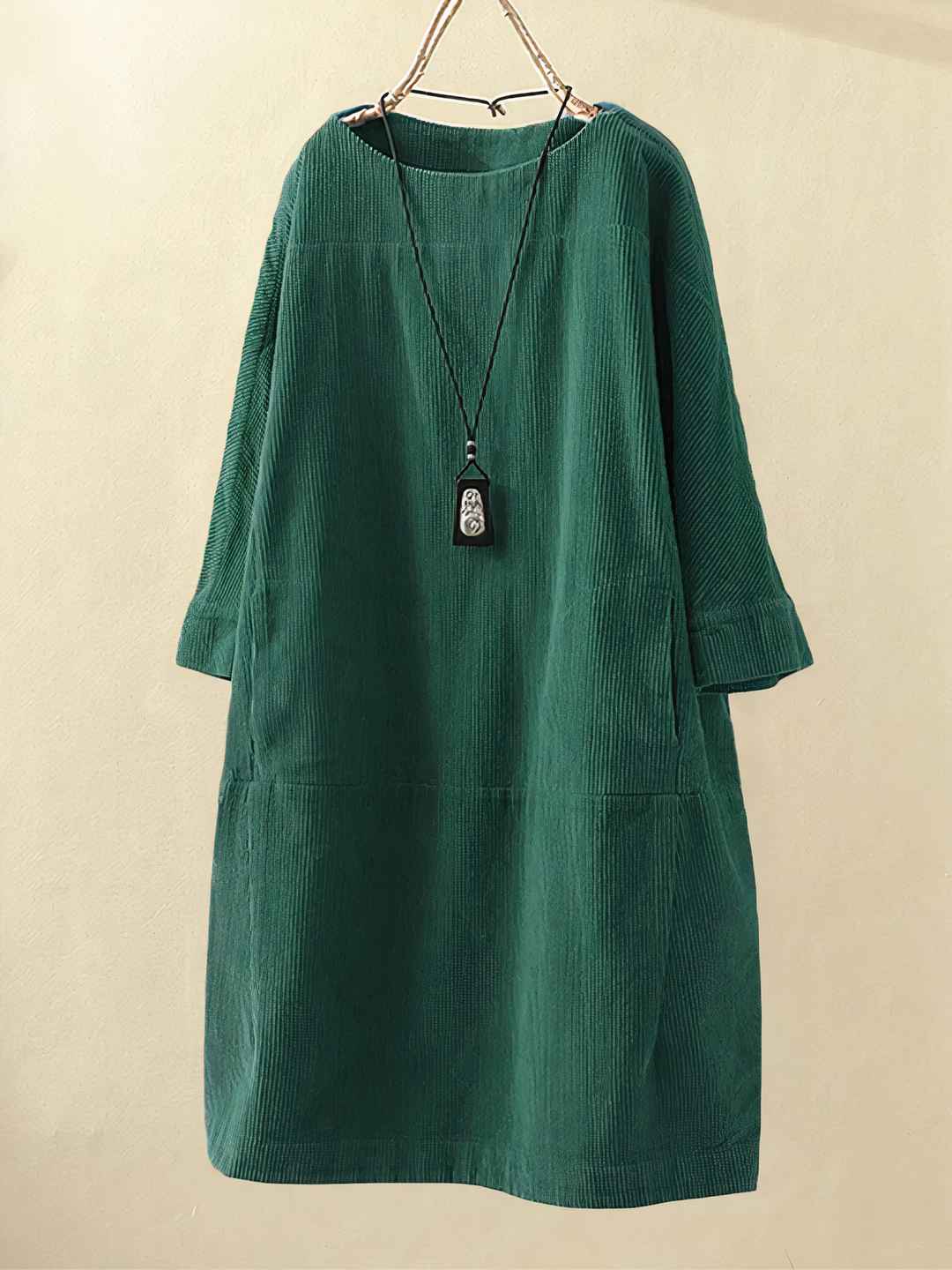 Stylish women's winter midi dress, textured for warmth & coziness, with functional pockets for everyday wear.