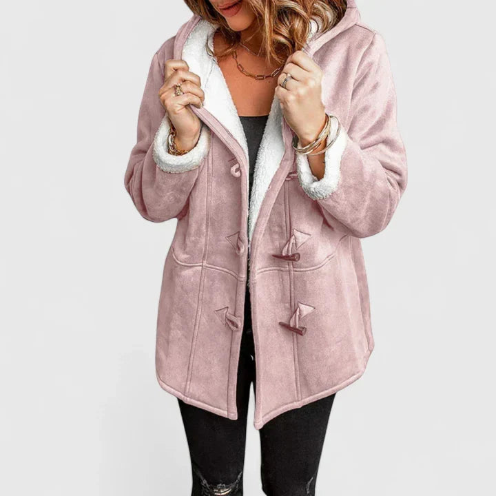 Close-up of women's toggle coat fasteners. Stylish and warm casual winter jacket with unique toggle closures.