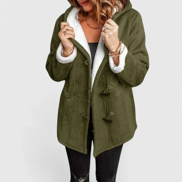Woman wearing a casual toggle winter coat outdoors. Comfortable and warm hooded jacket for everyday fall fashion.