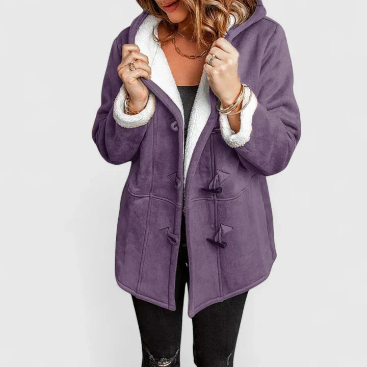 Stylish women's toggle coat with a protective hood. A warm and cozy winter jacket, essential for cold weather outerwear.
