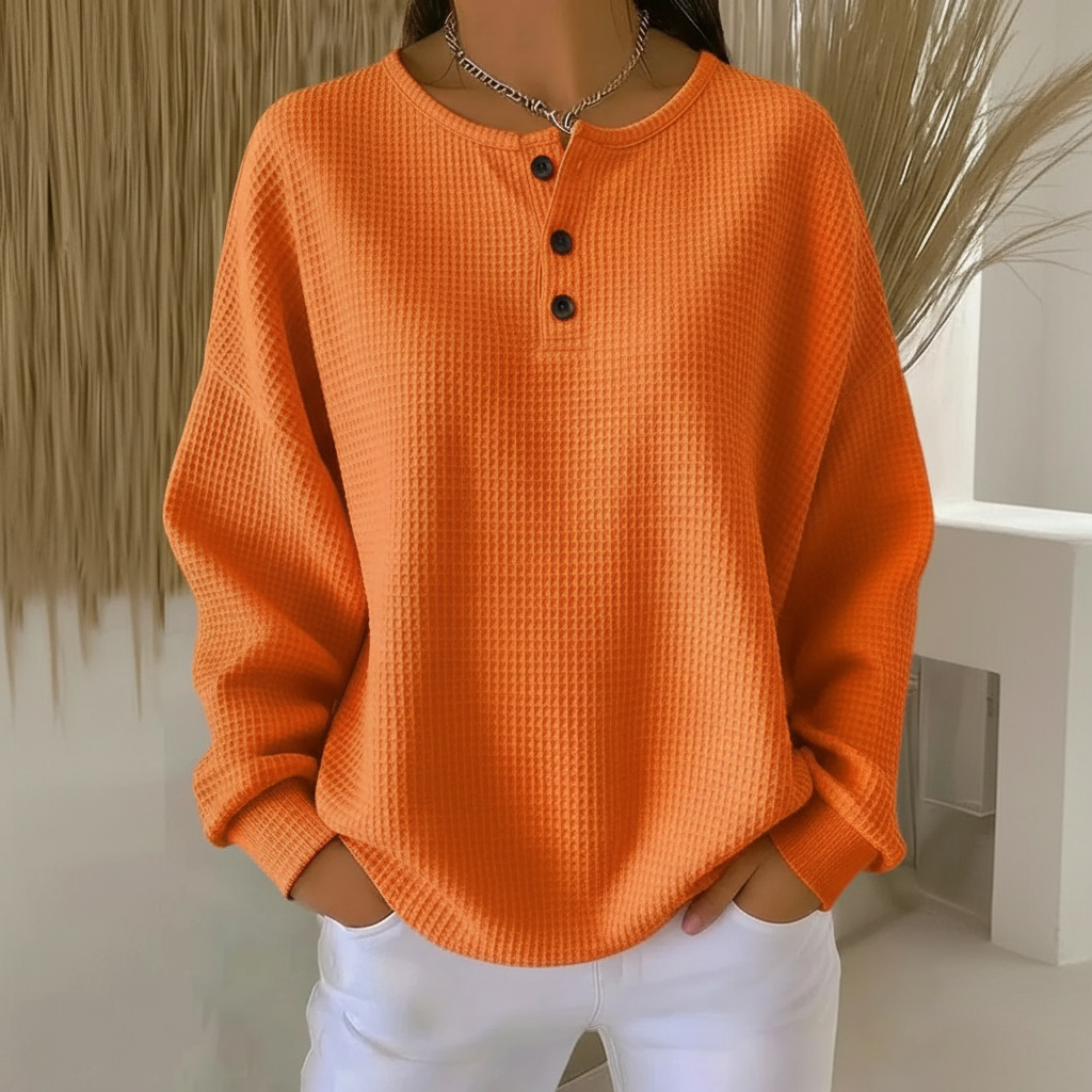 Women's cozy waffle knit sweater in a relaxed fit, perfect for fall & winter casual fashion. Comfortable long-sleeve top.