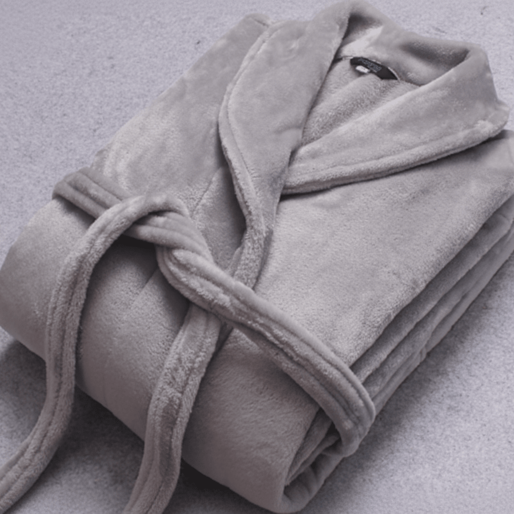Women's front-view cozy winter bathrobe, featuring a plush texture, belt, and handy pockets.