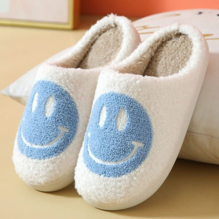 Ultra-soft women's winter comfort slippers with a smiley face detail and a thick, anti-slip indoor sole.