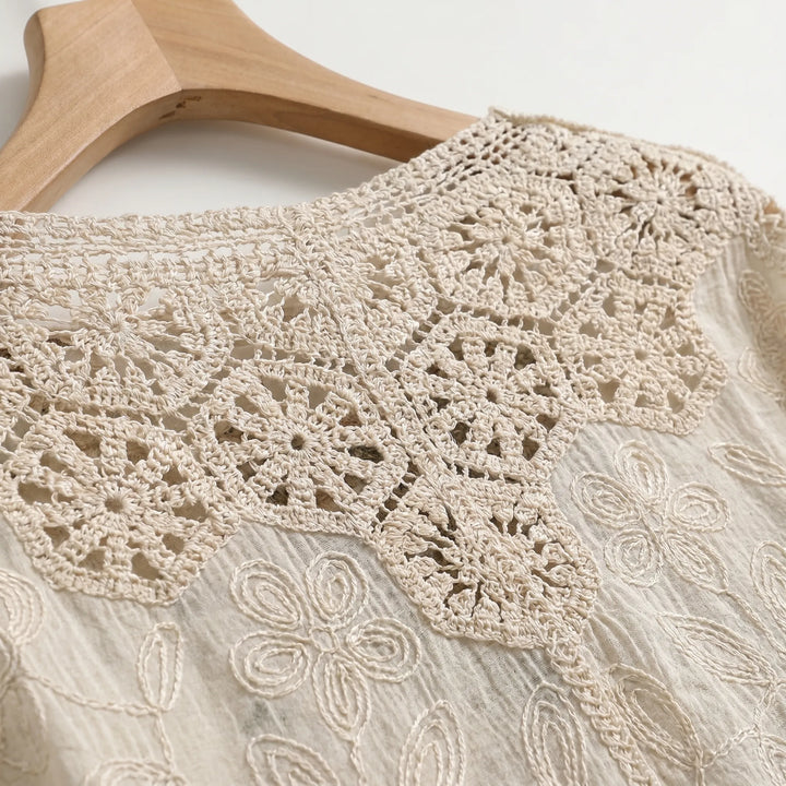 Textured cream bohemian open-front cardigan for women. Lightweight & relaxed, with three-quarter sleeves for summer style.