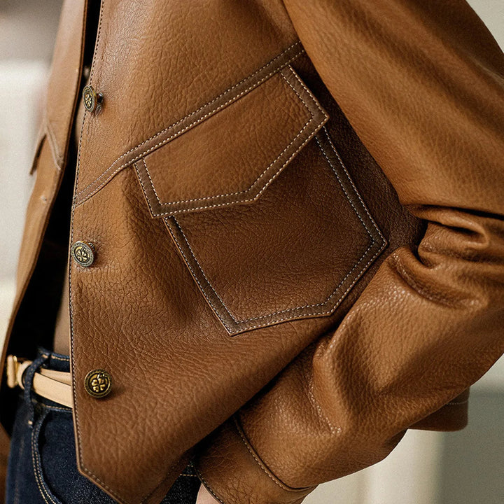 Elegant brown women's cropped blazer jacket featuring a structured lapel, a versatile fashion statement.