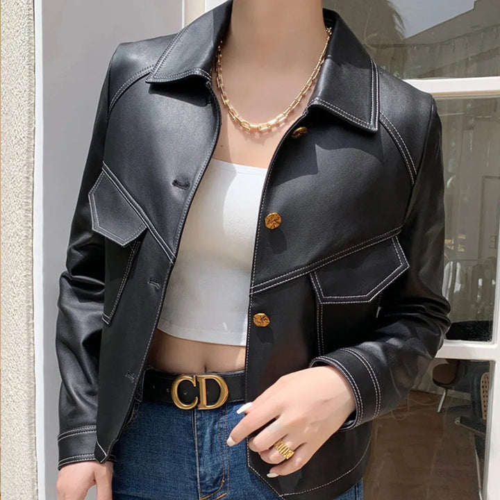 Women's cropped blazer jacket featuring a structured lapel and sleek design, ideal for contemporary fashion.