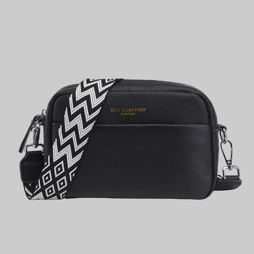 Women's crossbody bag with unique geometric strap. Versatile shoulder bag for everyday chic style.