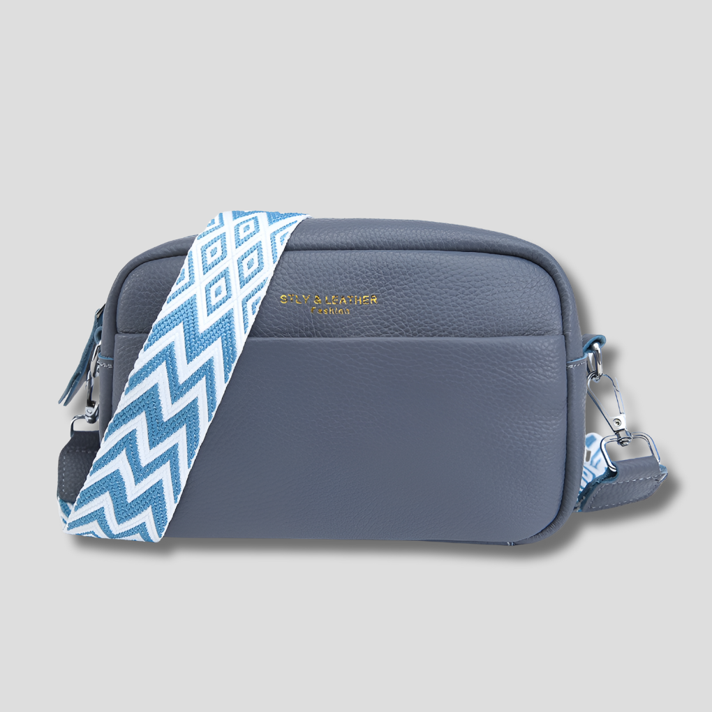 Stylish black women's crossbody bag with a distinctive geometric strap. Perfect chic purse for any outfit.
