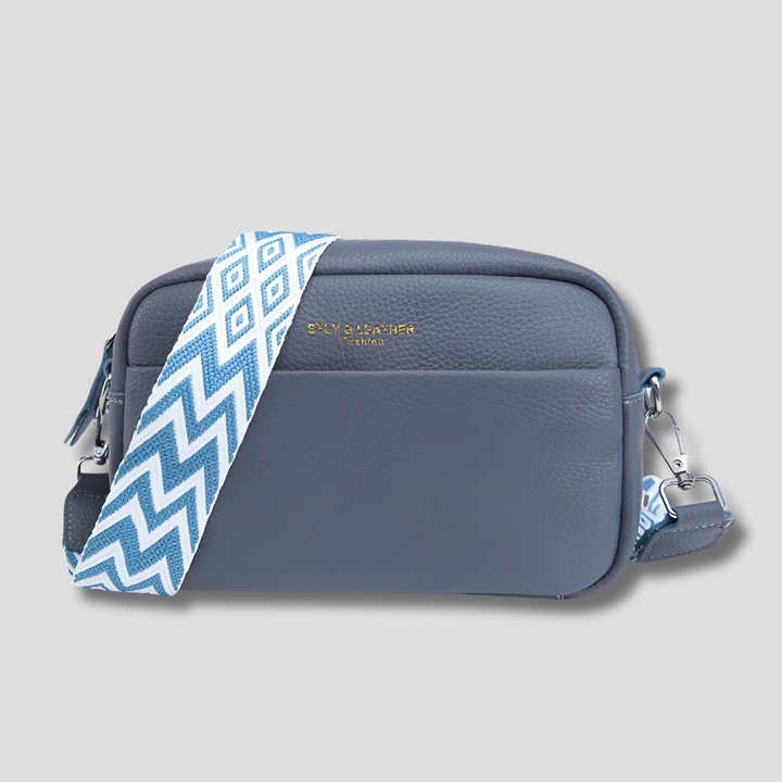 Stylish black women's crossbody bag with a distinctive geometric strap. Perfect chic purse for any outfit.