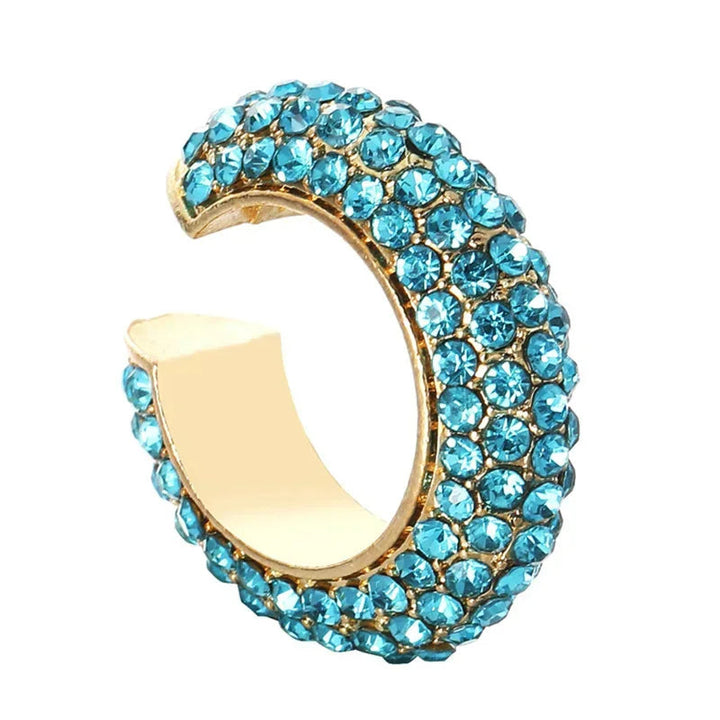Model wearing a sparkling pavé crystal no-piercing ear cuff, chic women's fashion accessory.