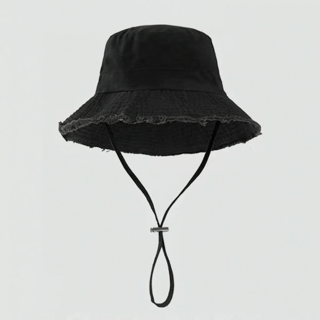 Fashionable women's sun hat: distressed bucket style with a comfortable chin strap and raw edge detailing.
