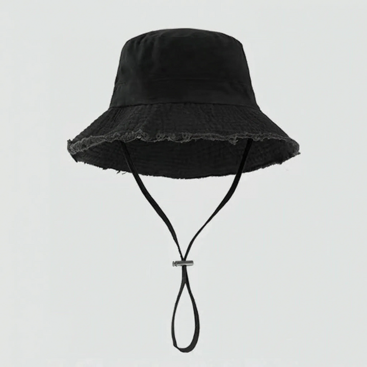 Fashionable women's sun hat: distressed bucket style with a comfortable chin strap and raw edge detailing.