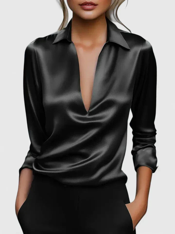 Flowy women's V-neck long sleeve blouse, elegantly draped. Modern, relaxed fit for versatile work & evening style.