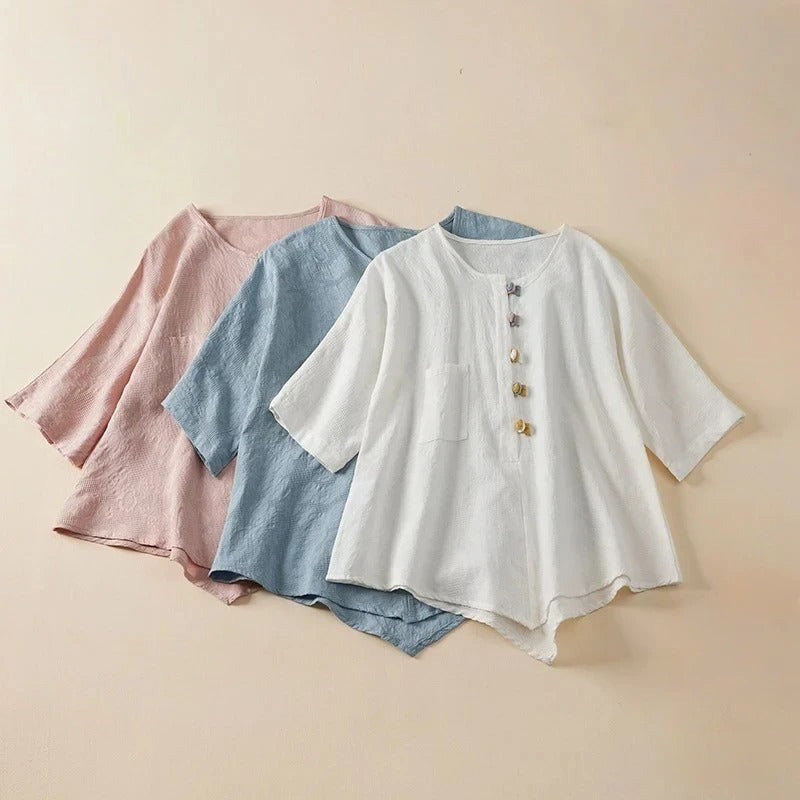 Stylish Eden Blouse for women featuring unique knotted buttons & a comfortable draped fit. Casual chic long sleeve top.