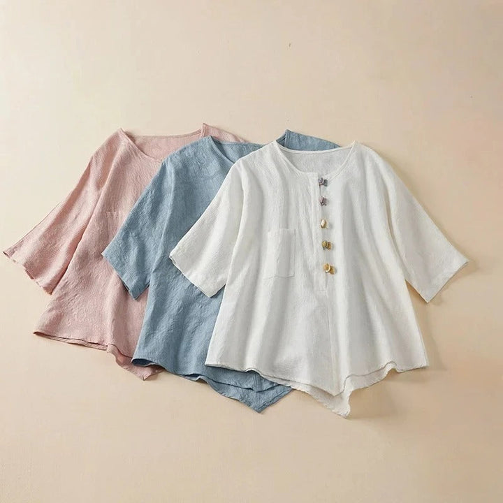 Stylish Eden Blouse for women featuring unique knotted buttons & a comfortable draped fit. Casual chic long sleeve top.
