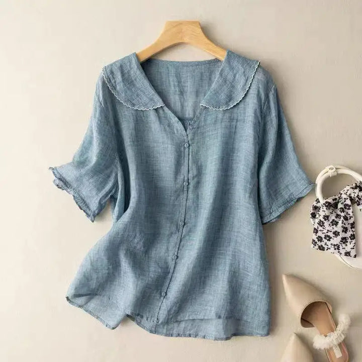 Stylish women's linen blouse in a relaxed fit. Breathable summer fashion top for comfortable everyday wear.