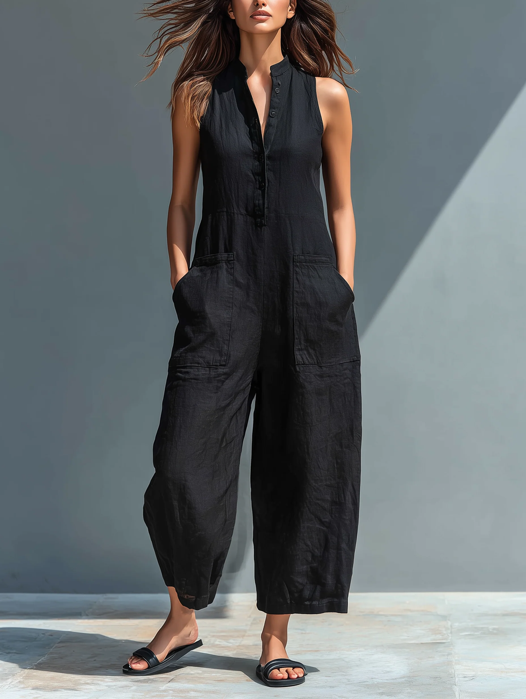 Women's elegant black sleeveless loose jumpsuit with stand collar, perfect for comfortable summer casual wear & loungewear.