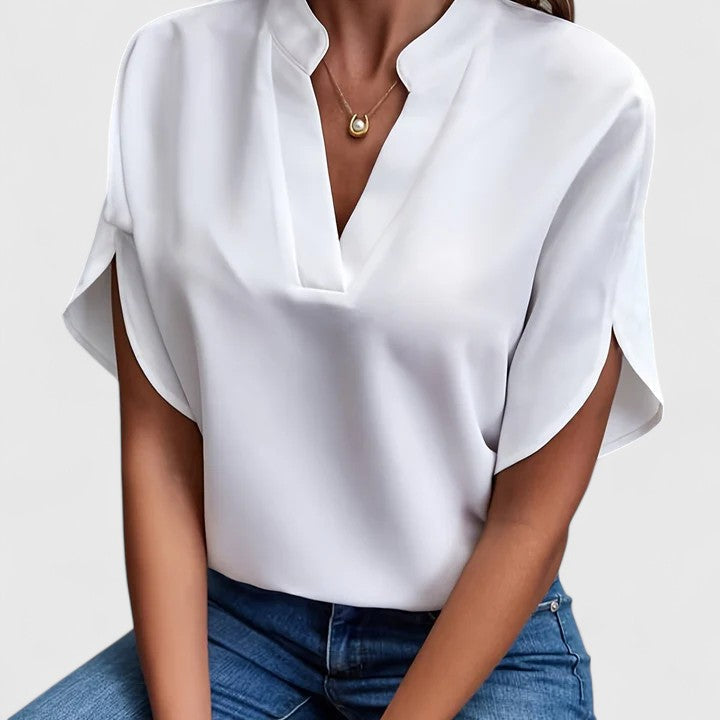 Women's elegant blouse, versatile for work or casual. Chic long sleeve top with flattering fit.
