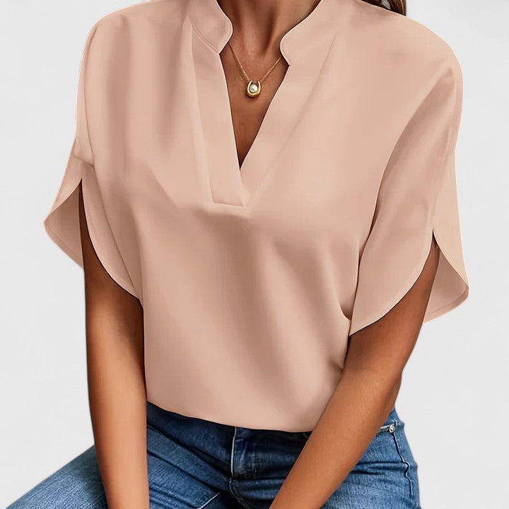 Spring/summer chic women's blouse. Versatile elegant top for work & casual fashion.