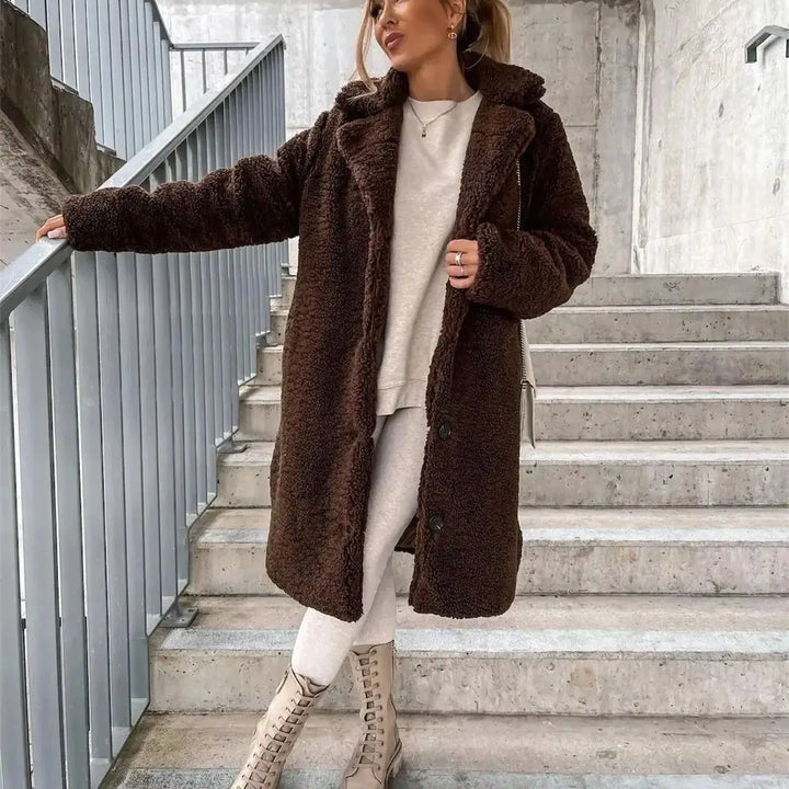 Women's elegant casual fall jacket, a cozy and stylish long coat designed for winter fashion layering.