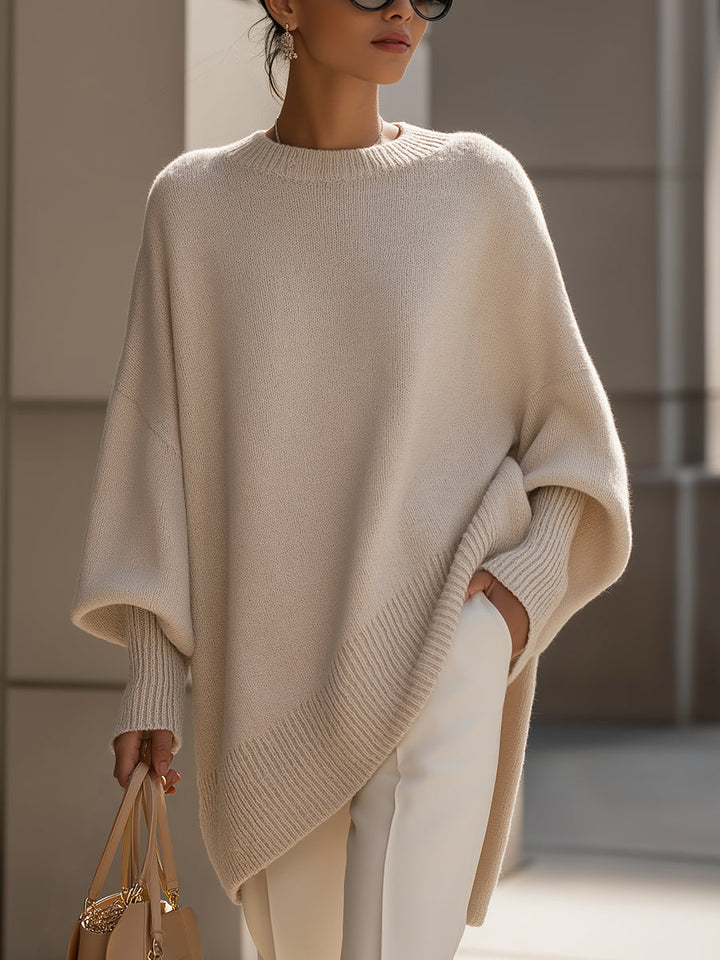 Women's elegant casual sweater with asymmetrical hem, long sleeves & relaxed fit for modern chic fashion.