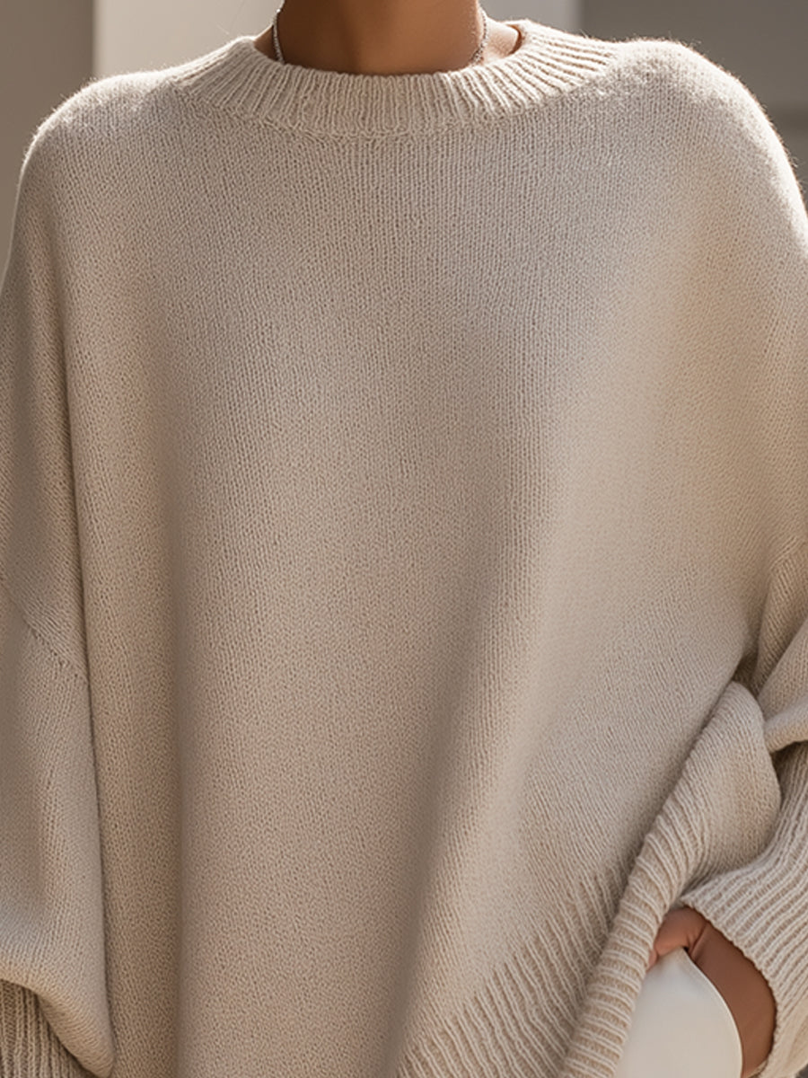Cozy women's casual sweater, elegant design, relaxed fit with stylish asymmetrical hem, perfect for versatile fashion.