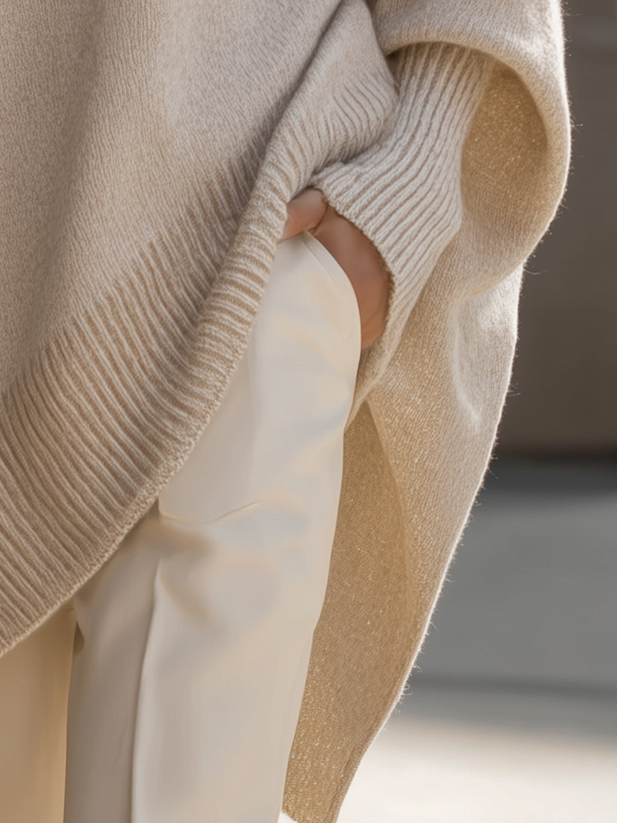 Relaxed fit women's sweater, elegant casual style with a unique asymmetrical hem, offering a modern chic silhouette.