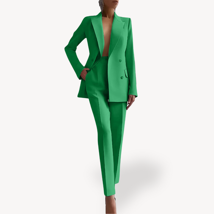 Modern women's two-piece pant suit with double-breasted blazer & tailored trousers. Elegant business fashion.