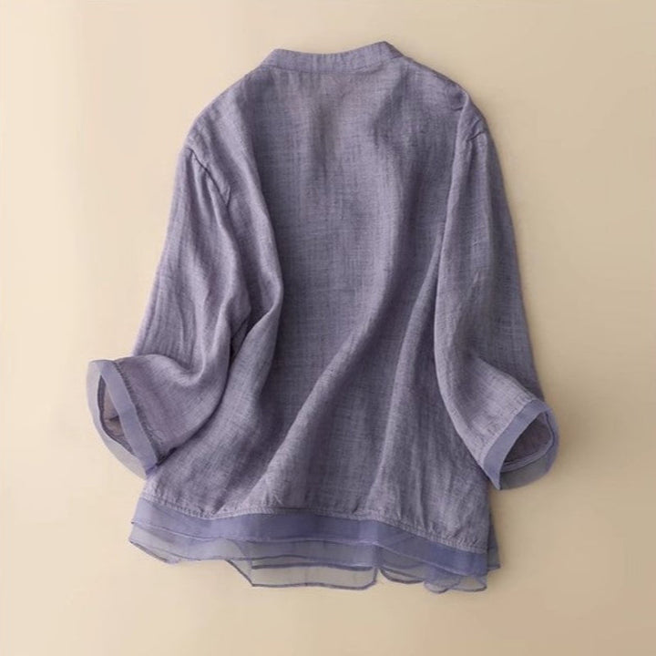 Elegant women's V-neck blouse featuring delicate embroidery, a versatile top for spring & summer chic.