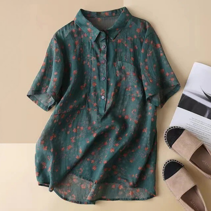 Women's elegant floral half-placket shirt with vibrant print, short sleeves, and button detail for summer fashion.