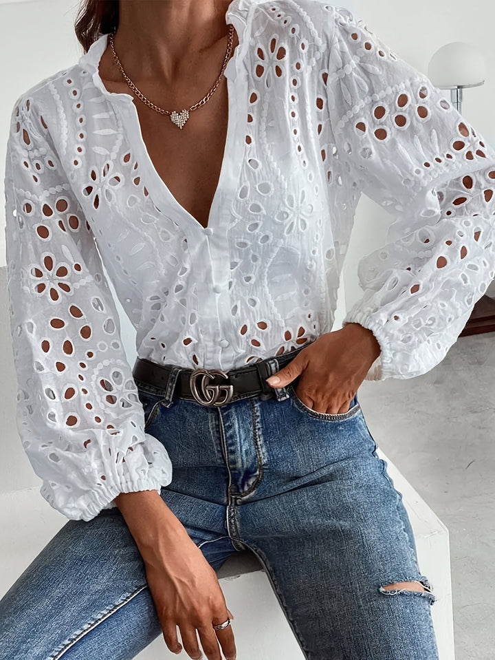 Women's elegant floral long-sleeve blouse with stylish button closure. Perfect for office or casual wear.