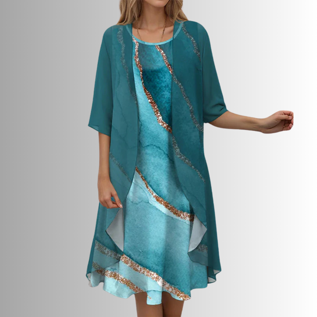 Comfortable flowing women's floral midi dress with a soft cardigan, ideal for a relaxed yet chic summer look.