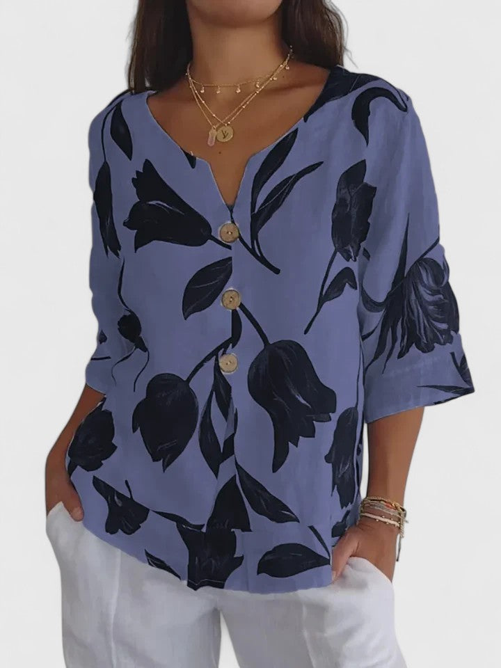 Comfortable women's floral V-neck top, versatile for everyday chic or stylish summer wear. Relaxed fit blouse.