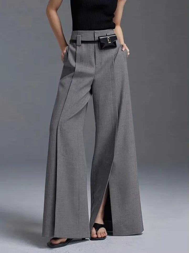 Comfortable high-waisted wide-leg pants for women, featuring elegant front slits. Ideal for casual or dressy styles.