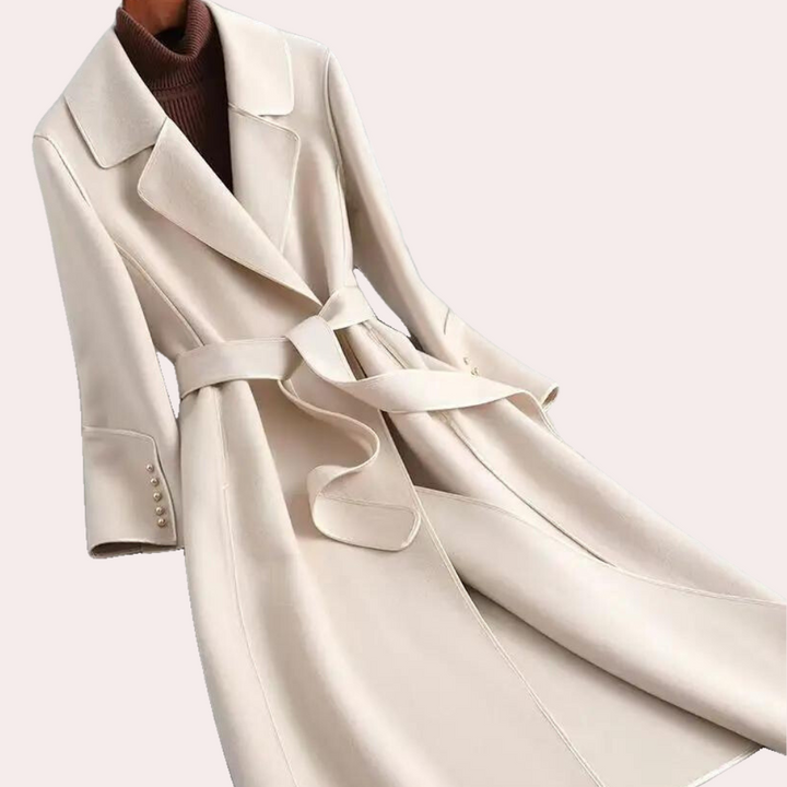 Elegant women's long coat with prominent double-button closure and a chic, adjustable belted waist. Versatile.
