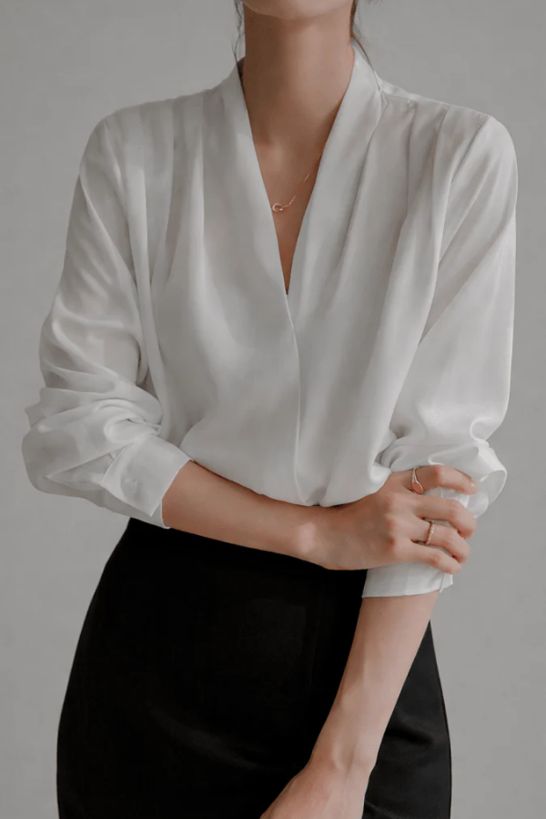 Women's elegant long sleeve wrap blouse. Perfect for sophisticated office wear or a chic everyday style.