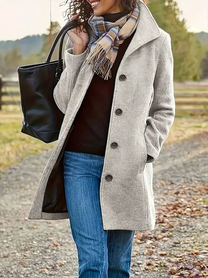 Women's elegant mid-length trench coat with lapel collar & button-front closure, perfect for fall fashion.