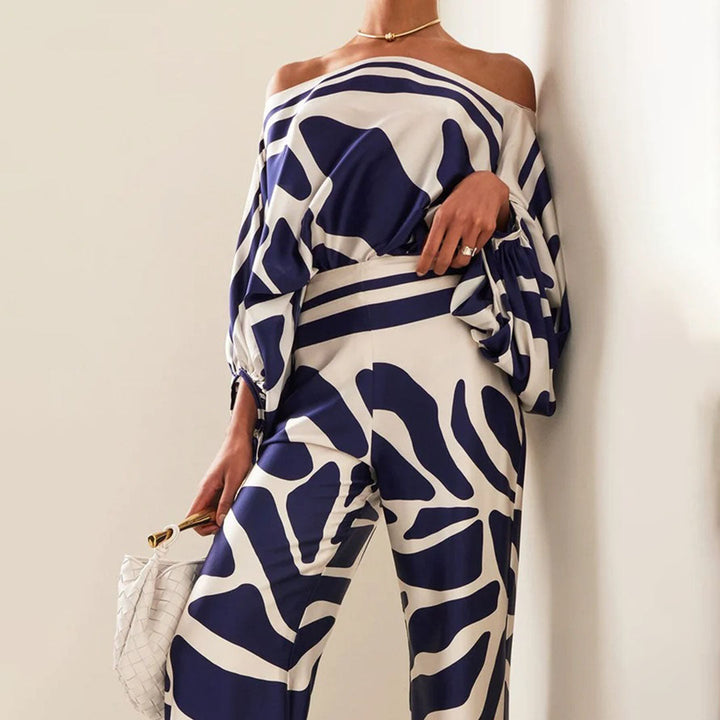 Elegant women's one-shoulder printed pants set, a chic ladies' evening wear outfit with an abstract design.