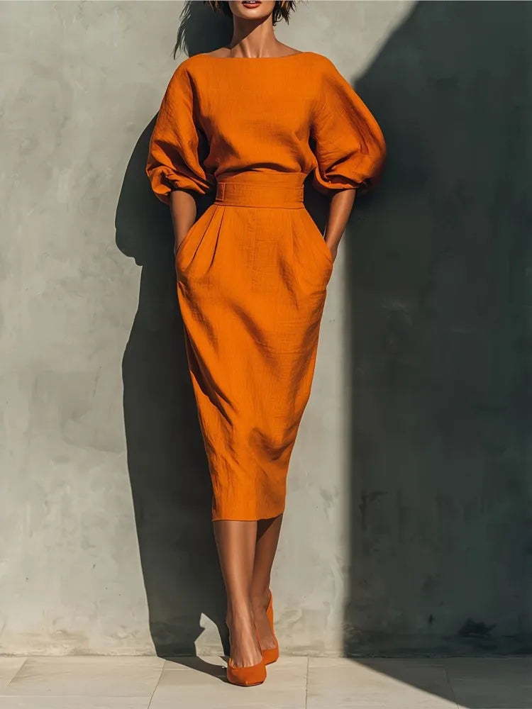 Women's elegant puff sleeve midi dress with pockets, perfect for versatile styling.