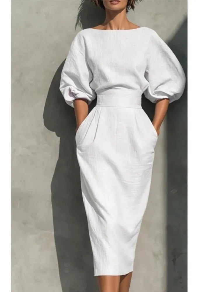 Versatile women's midi dress with puff sleeves & pockets, great for casual outings or elegant events.