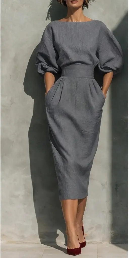 Elegant women's puff sleeve midi dress with a round neck and convenient pockets, suitable for many occasions.