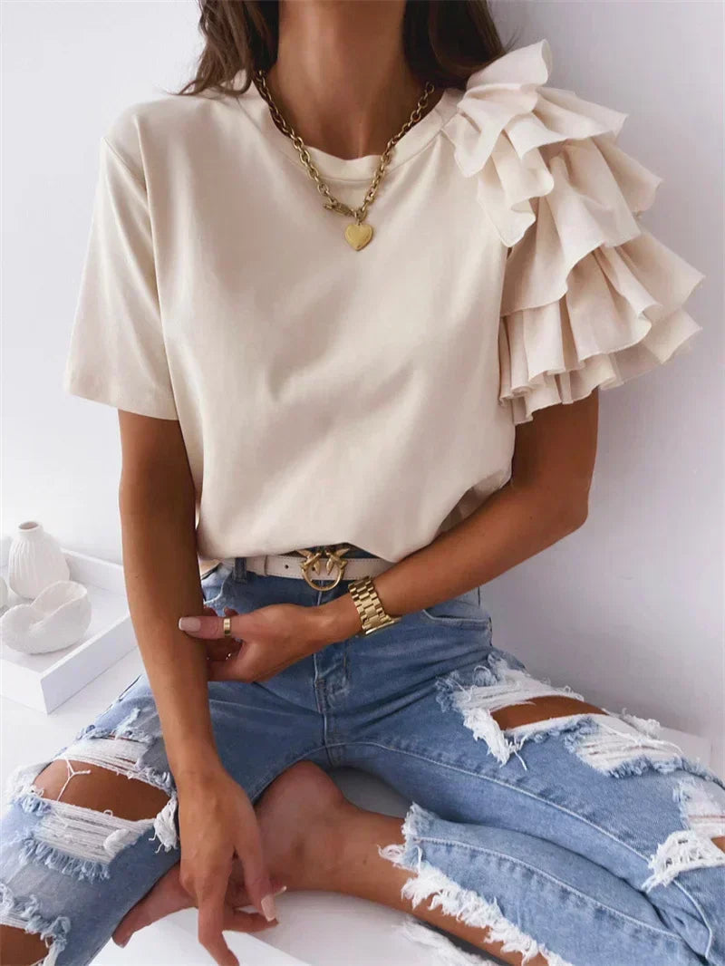 White women's ruffle sleeve top featuring unique statement sleeves, ideal for a casual chic summer style.