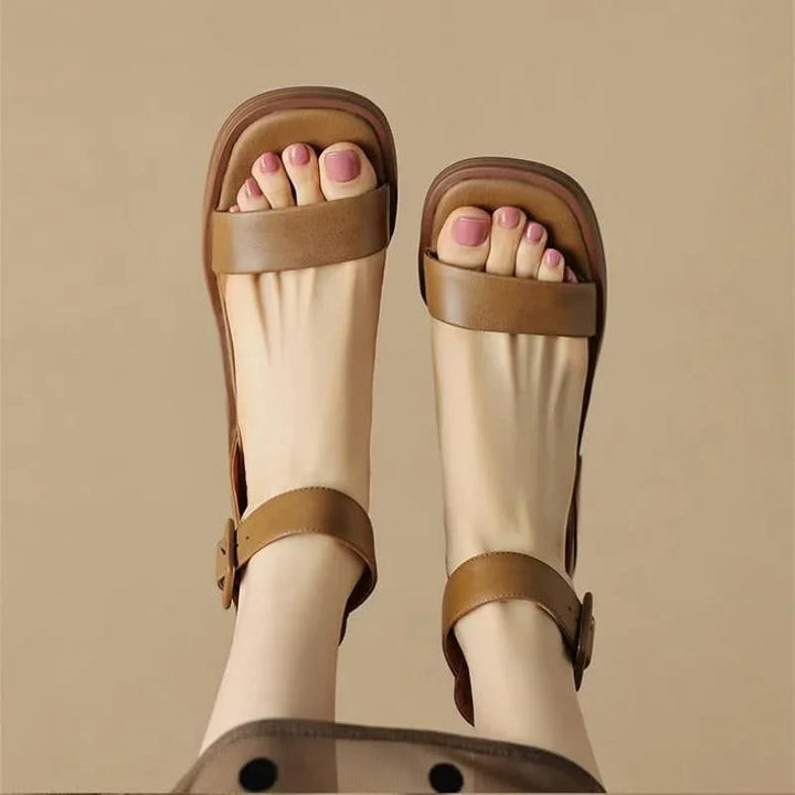 Women's elegant block heels with secure ankle strap, a classic and comfortable footwear choice.