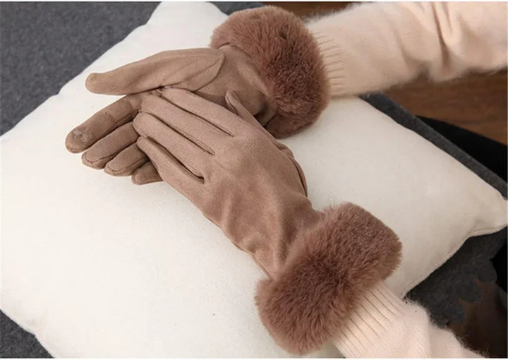 Touch screen compatible women's suede gloves with chic faux fur trim.