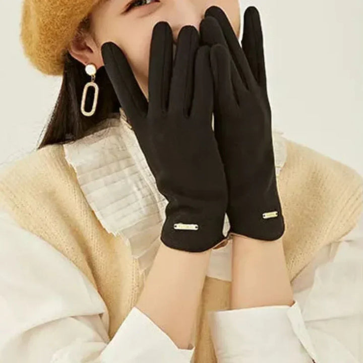 Luxurious women's suede touchscreen gloves, cashmere-lined for superior comfort and cold weather protection.