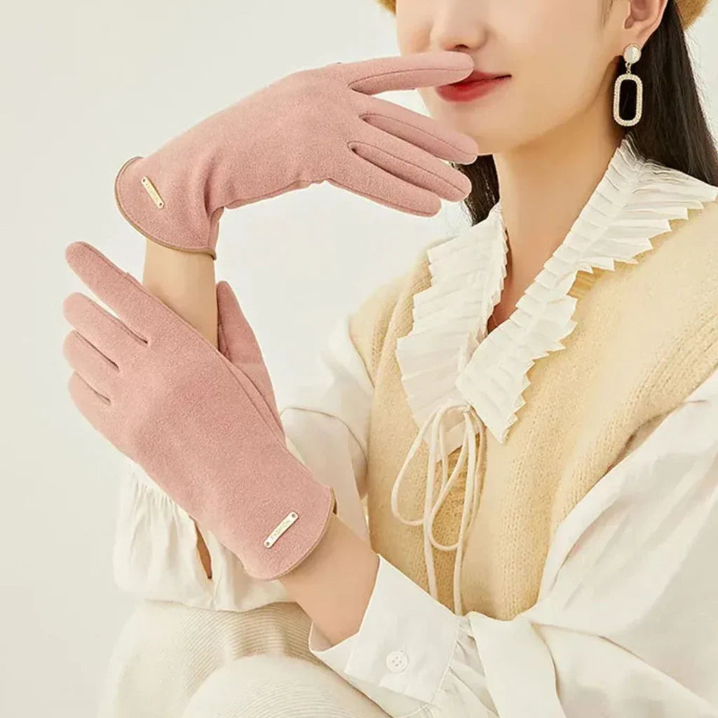 Soft women's suede gloves with cashmere lining, providing elegant warmth and touchscreen functionality.