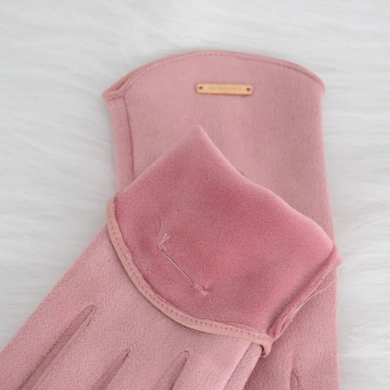 Soft suede women's gloves with luxurious cashmere lining, ideal for cold weather touchscreen operation.