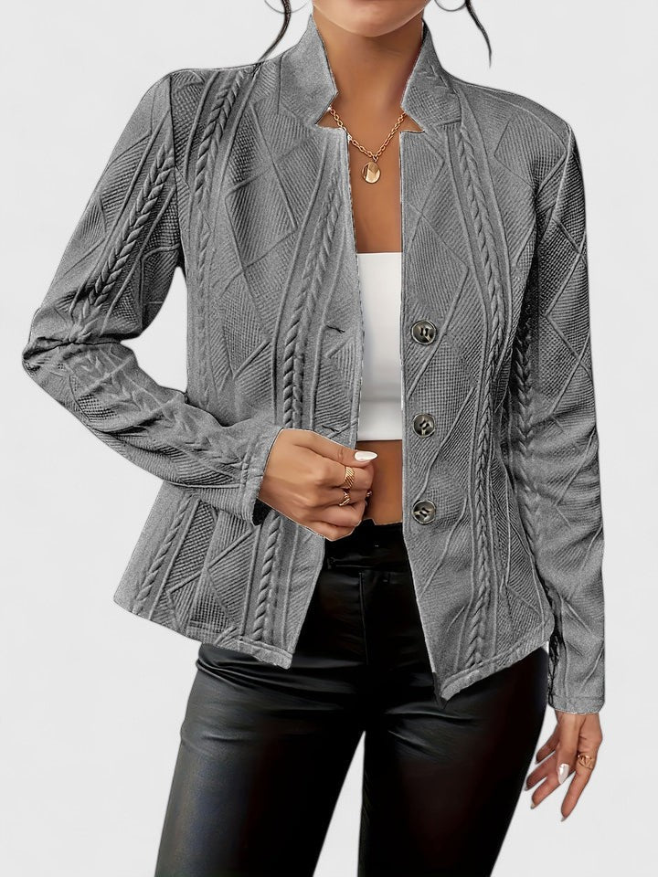 Sophisticated women's tailored jacket, ideal for office wear and professional settings. Elegant, structured design.