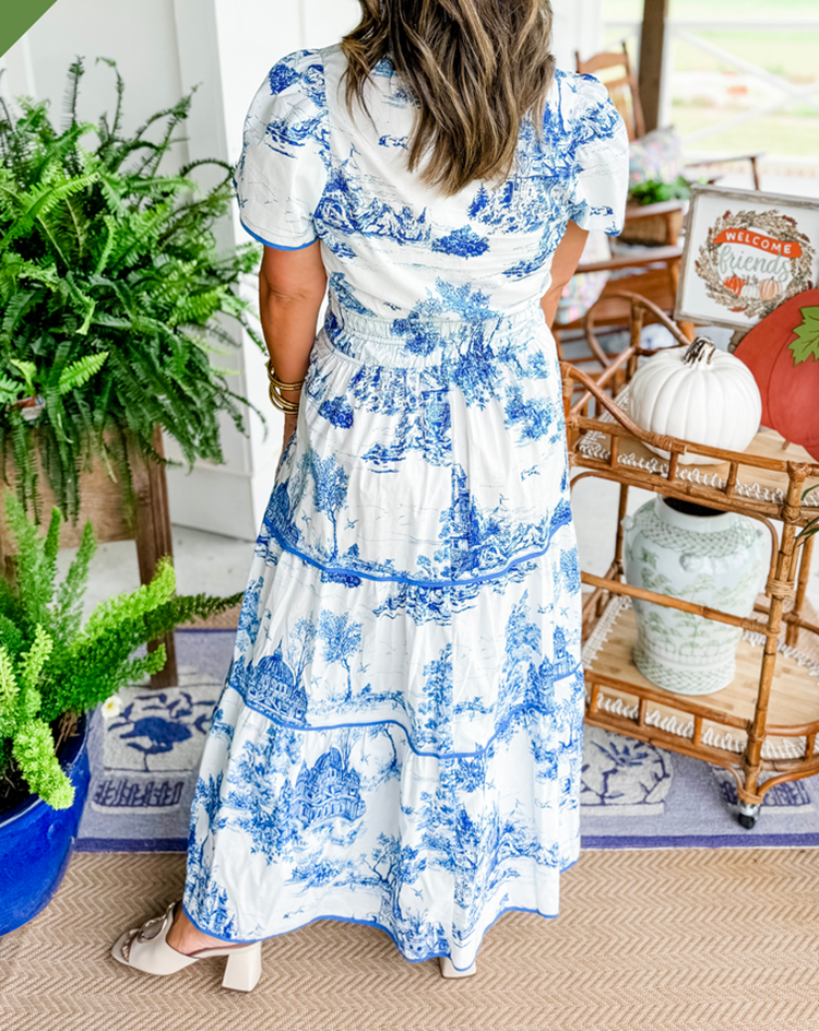 Women's flowing toile maxi dress with elegant v-neck design, ideal for spring/summer comfort.